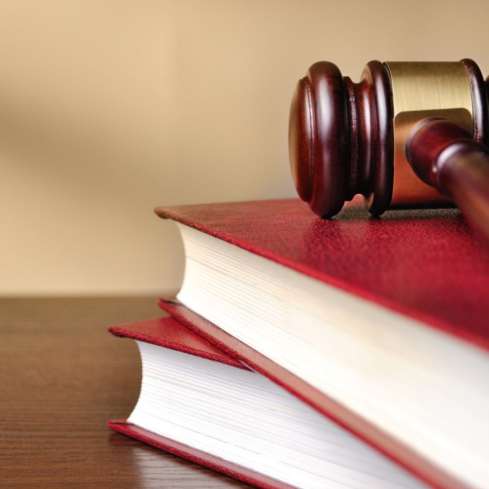 Wooden judges gavel on a law book